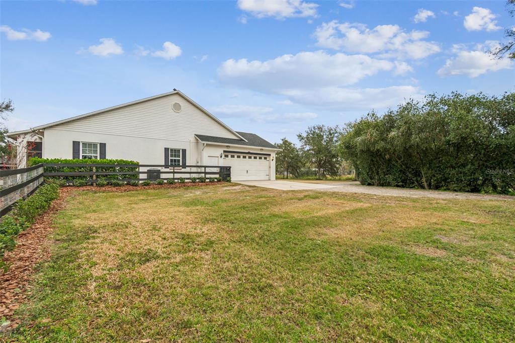 3077 Cork Road Plant City, FL 33565 - Photo 83 of 99 a view of a house with a yard