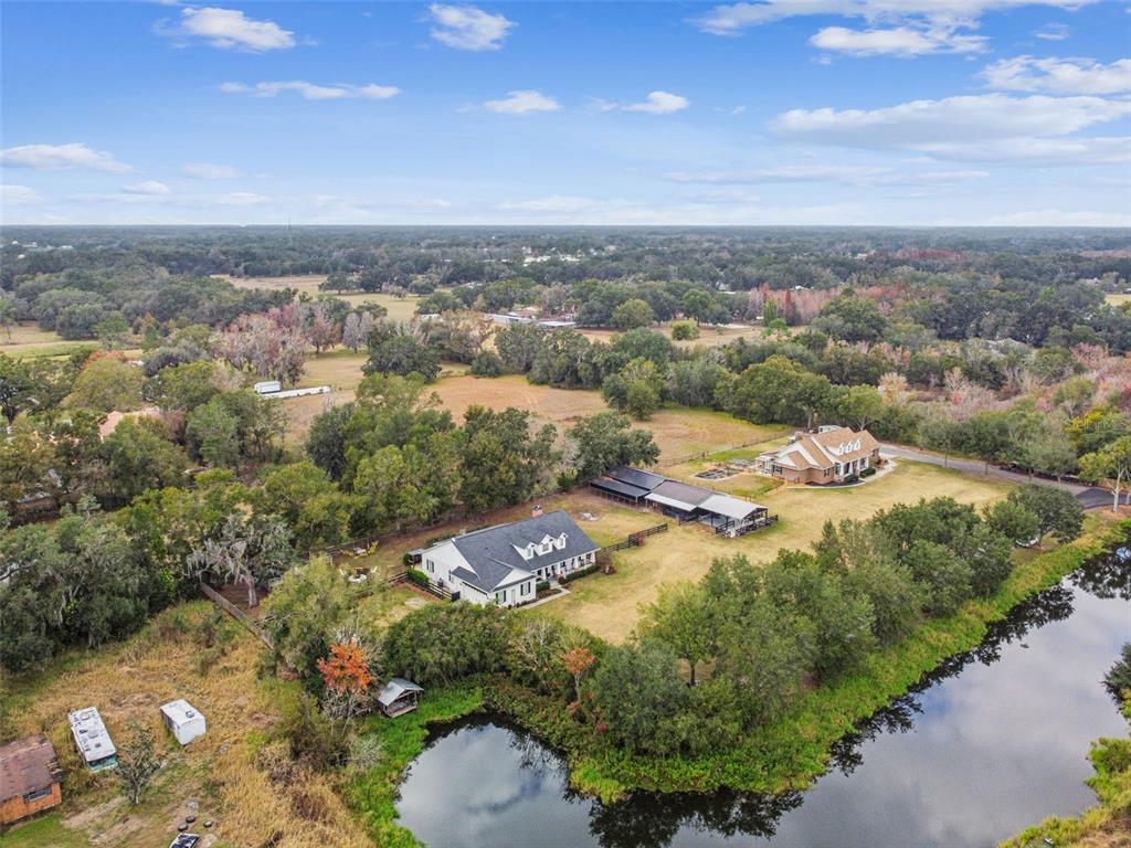 3077 Cork Road Plant City, FL 33565 - Photo 95 of 99 an aerial view of residential houses with outdoor space