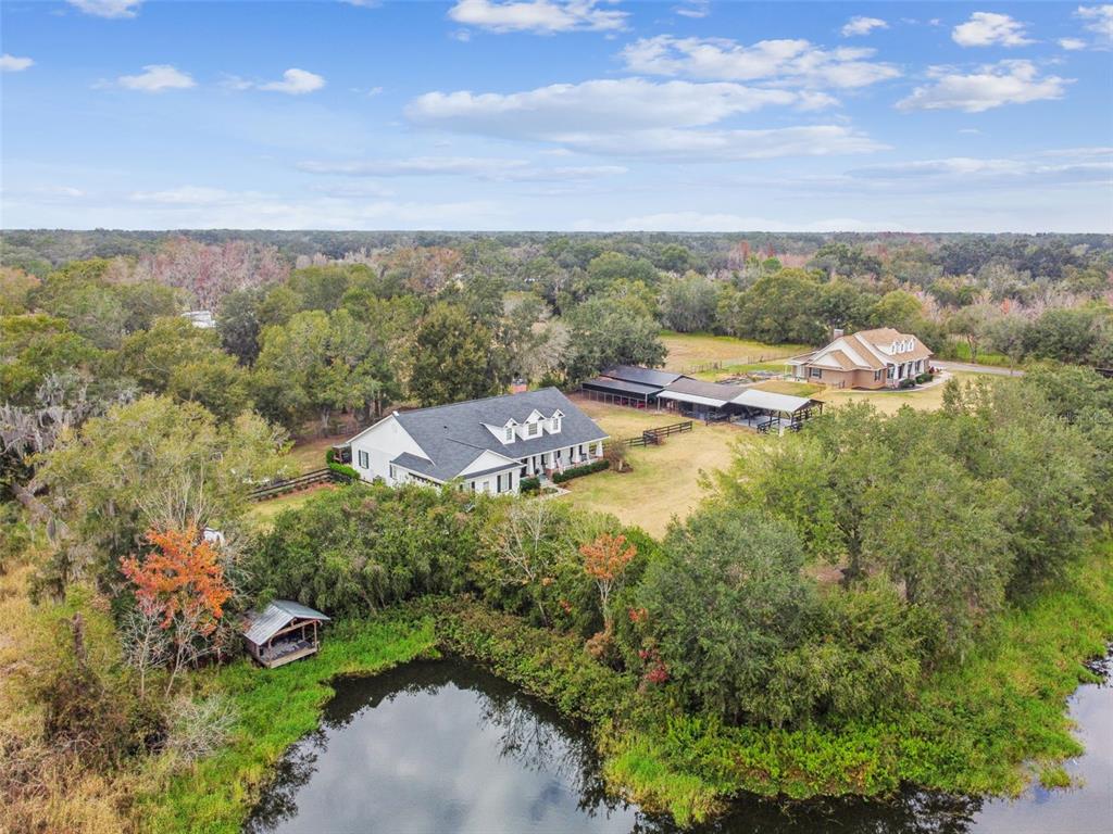 3077 Cork Road Plant City, FL 33565 - Photo 98 of 99 an aerial view of residential house with outdoor space