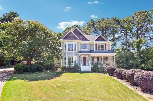 a view of house with yard outdoor seating and entertaining space
