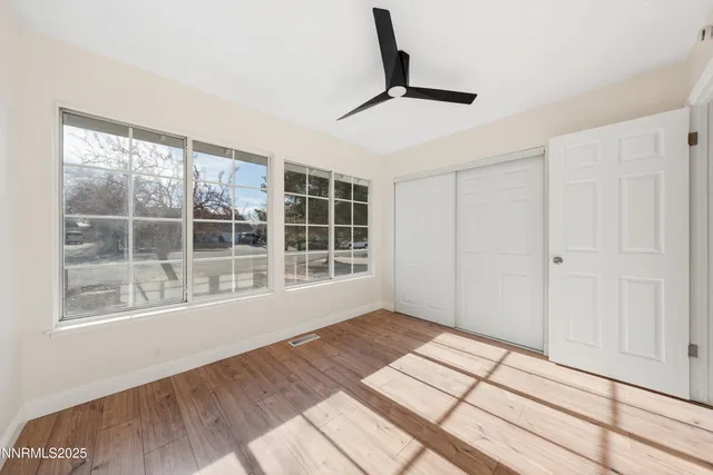 a view of empty room with windows