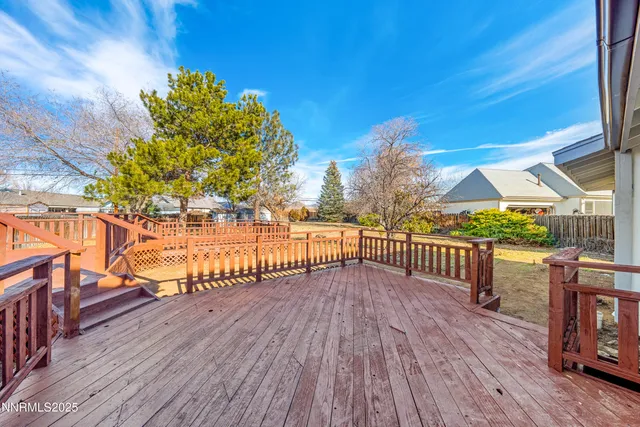 a view of a balcony with wooden floor
