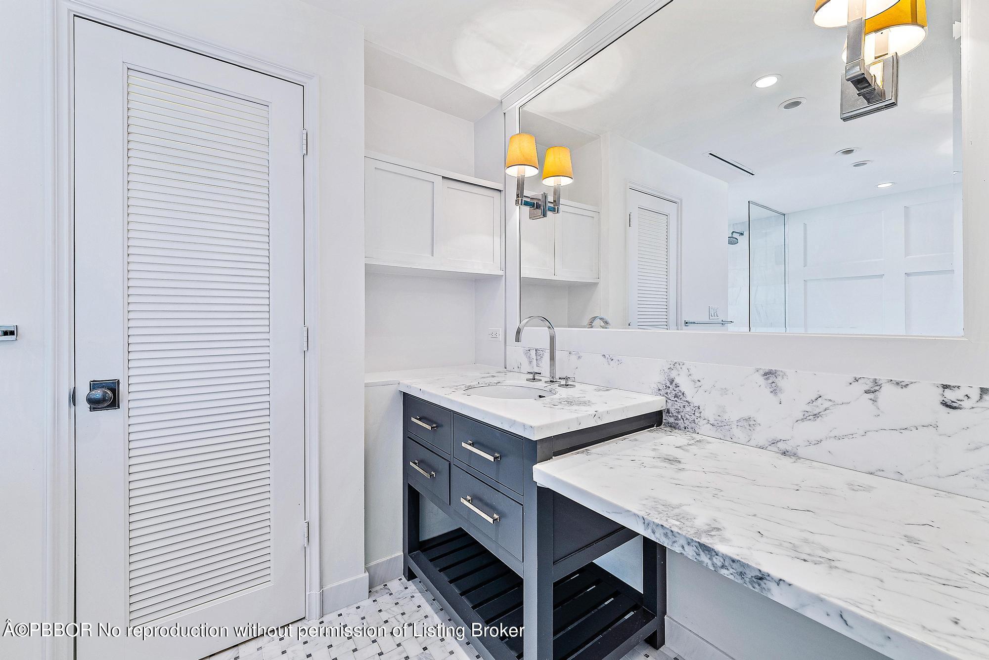 111 Reef Road Palm Beach, FL 33480 - Photo 13 of 28 a utility room with a sink and cabinets