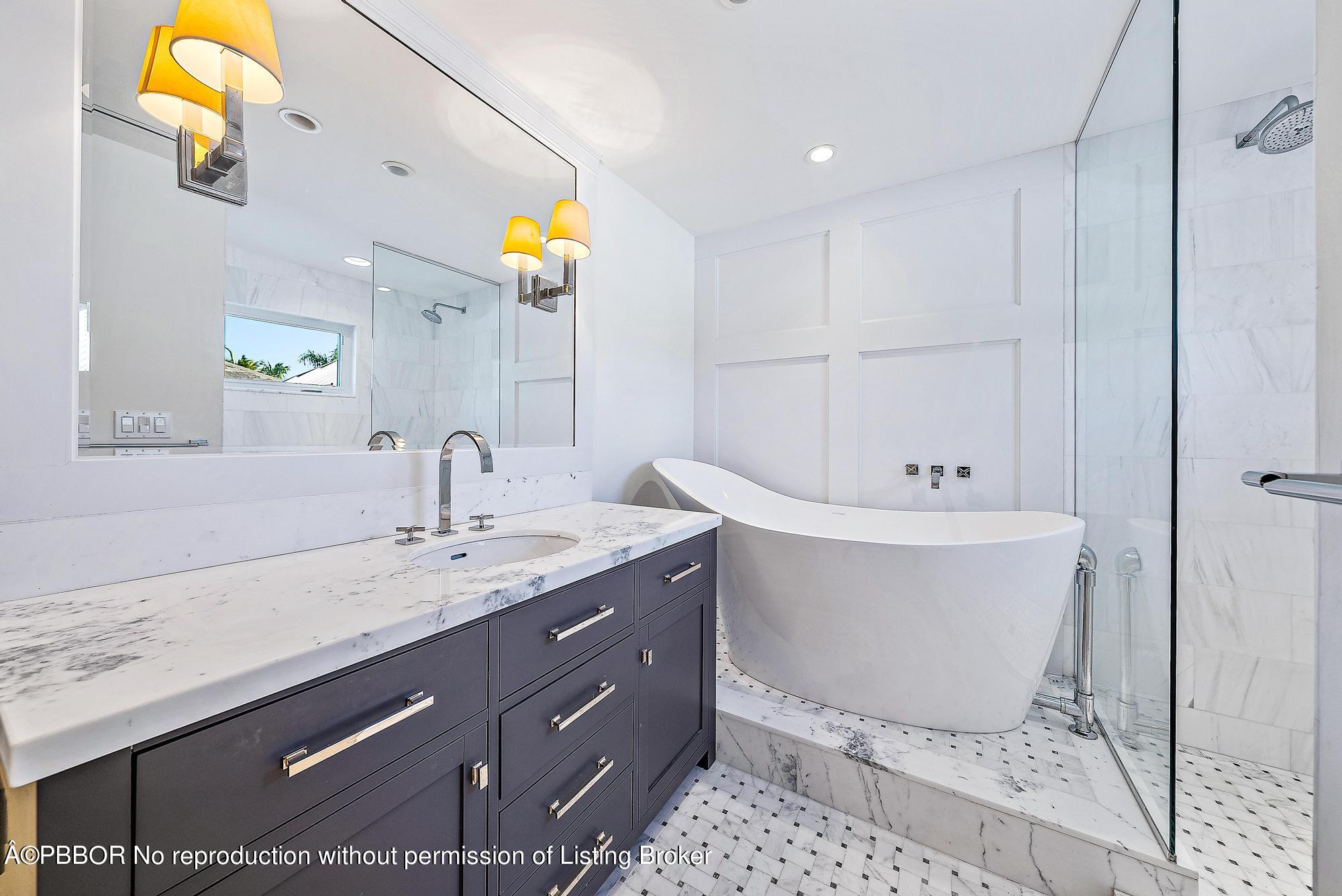 111 Reef Road Palm Beach, FL 33480 - Photo 14 of 28 a bathroom with a sink and a mirror