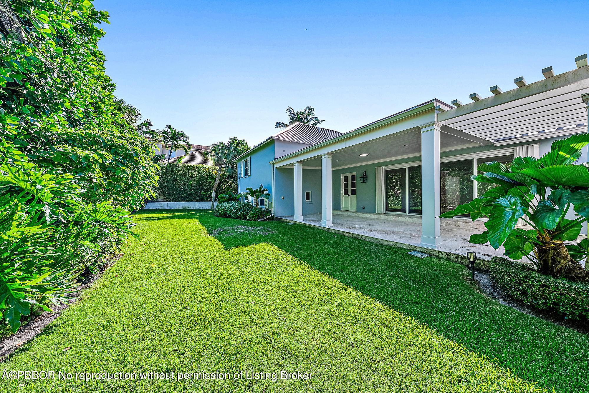 111 Reef Road Palm Beach, FL 33480 - Photo 19 of 28 a view of a house with a yard and sitting area