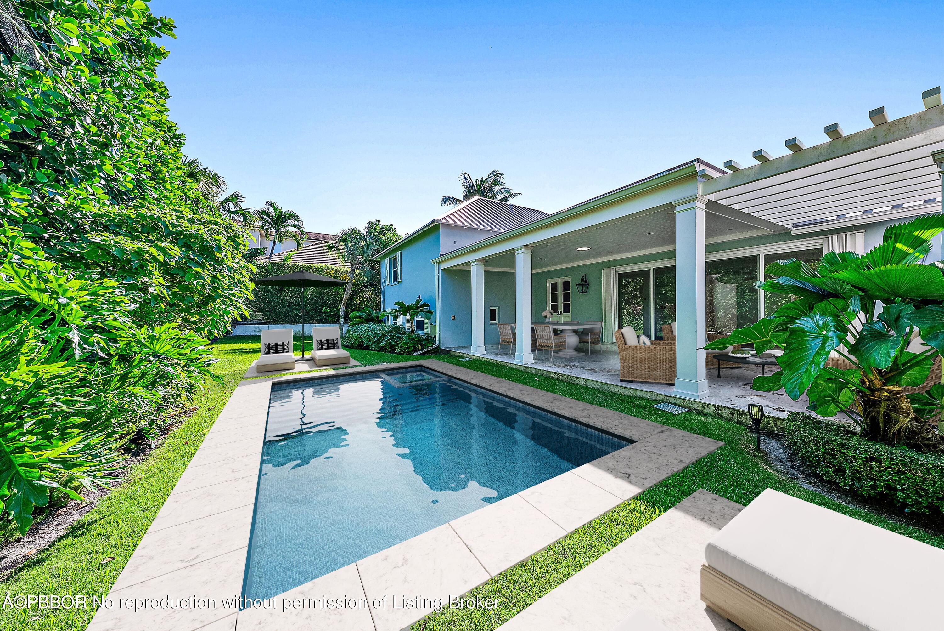 111 Reef Road Palm Beach, FL 33480 - Photo 20 of 28 a view of a house with a swimming pool