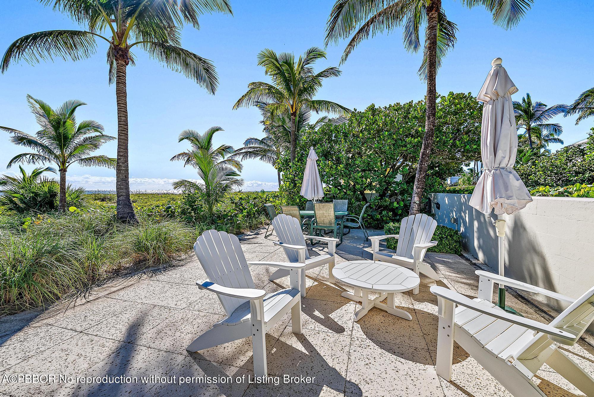 111 Reef Road Palm Beach, FL 33480 - Photo 22 of 28 a view of a backyard with plants and a patio