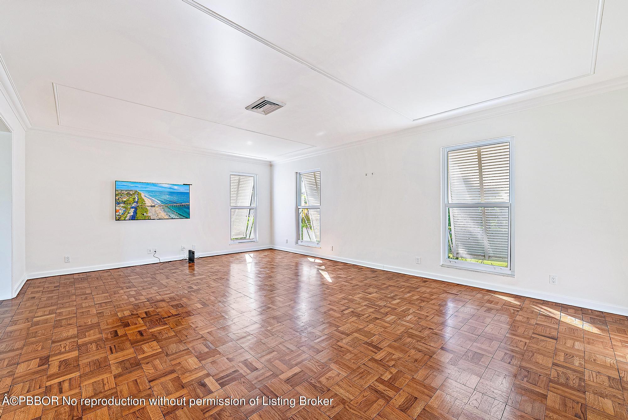 111 Reef Road Palm Beach, FL 33480 - Photo 5 of 28 wooden floor in an empty room with a window