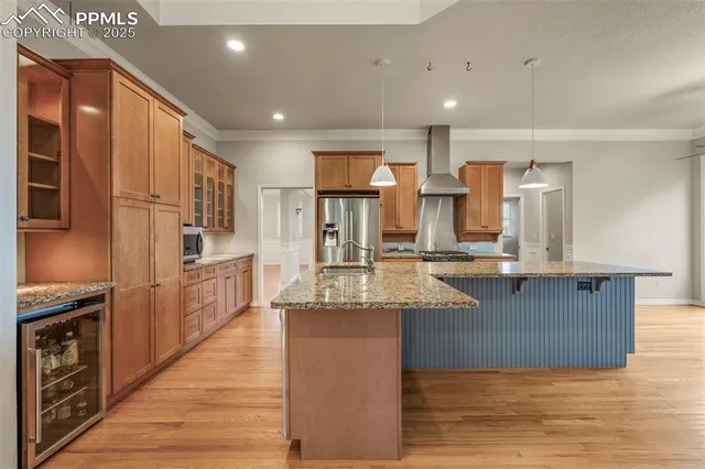 a large kitchen with stainless steel appliances kitchen island granite countertop a large counter top stainless steel appliances and cabinets