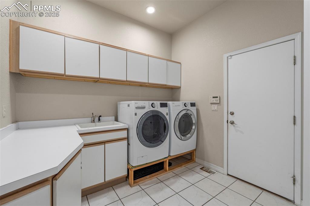 4930 Langdale Way Colorado Springs, CO 80906 - Photo 19 of 49 a utility room with dryer and washer