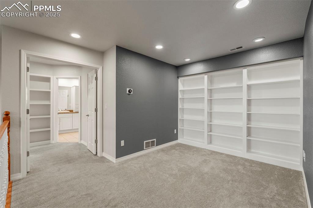 4930 Langdale Way Colorado Springs, CO 80906 - Photo 27 of 49 a view of an empty room with a cabinet and a window