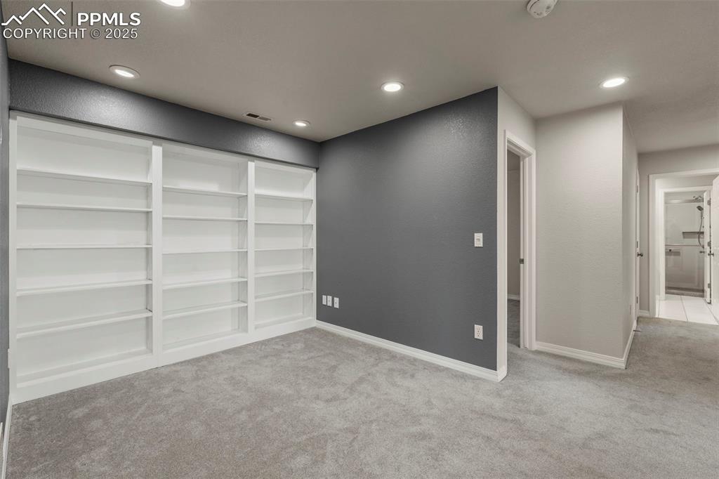 4930 Langdale Way Colorado Springs, CO 80906 - Photo 28 of 49 a view of an empty room with a cabinet and a window
