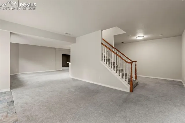 a view of a hallway with staircase