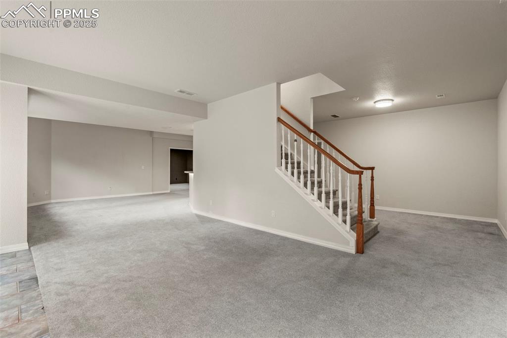 4930 Langdale Way Colorado Springs, CO 80906 - Photo 38 of 49 a view of a hallway with staircase