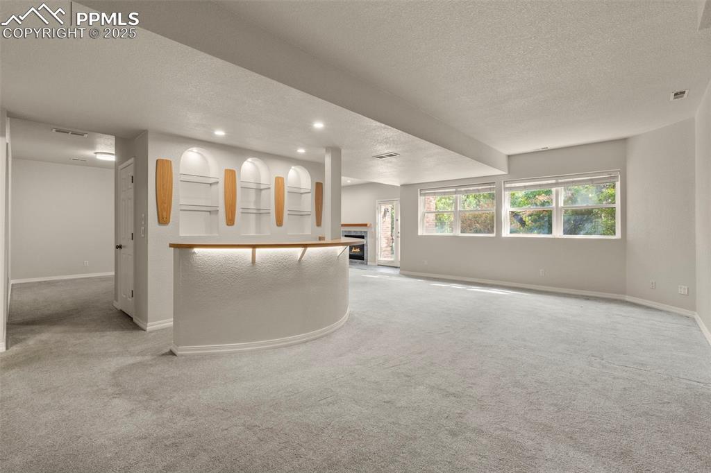 4930 Langdale Way Colorado Springs, CO 80906 - Photo 39 of 49 an empty room with a kitchen and a window