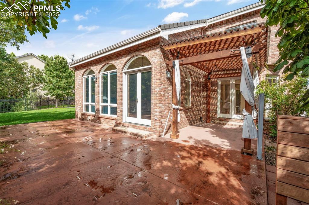 4930 Langdale Way Colorado Springs, CO 80906 - Photo 46 of 49 a view of a house with a yard