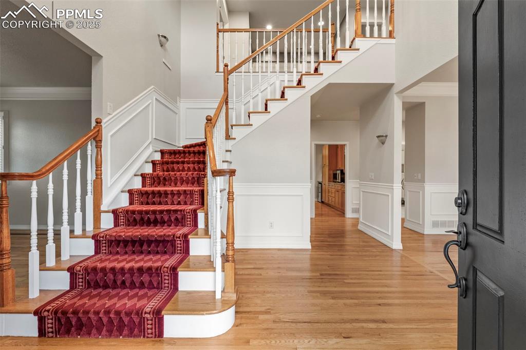 4930 Langdale Way Colorado Springs, CO 80906 - Photo 6 of 49 a view of entryway and hall with wooden floor