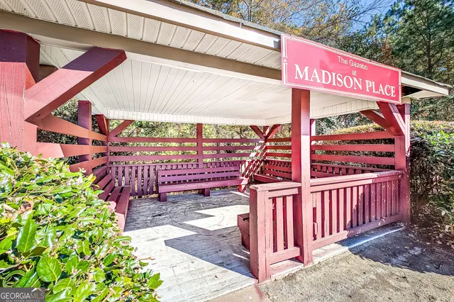 a view of a street with an outdoor seating