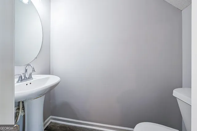 a bathroom with a sink a toilet