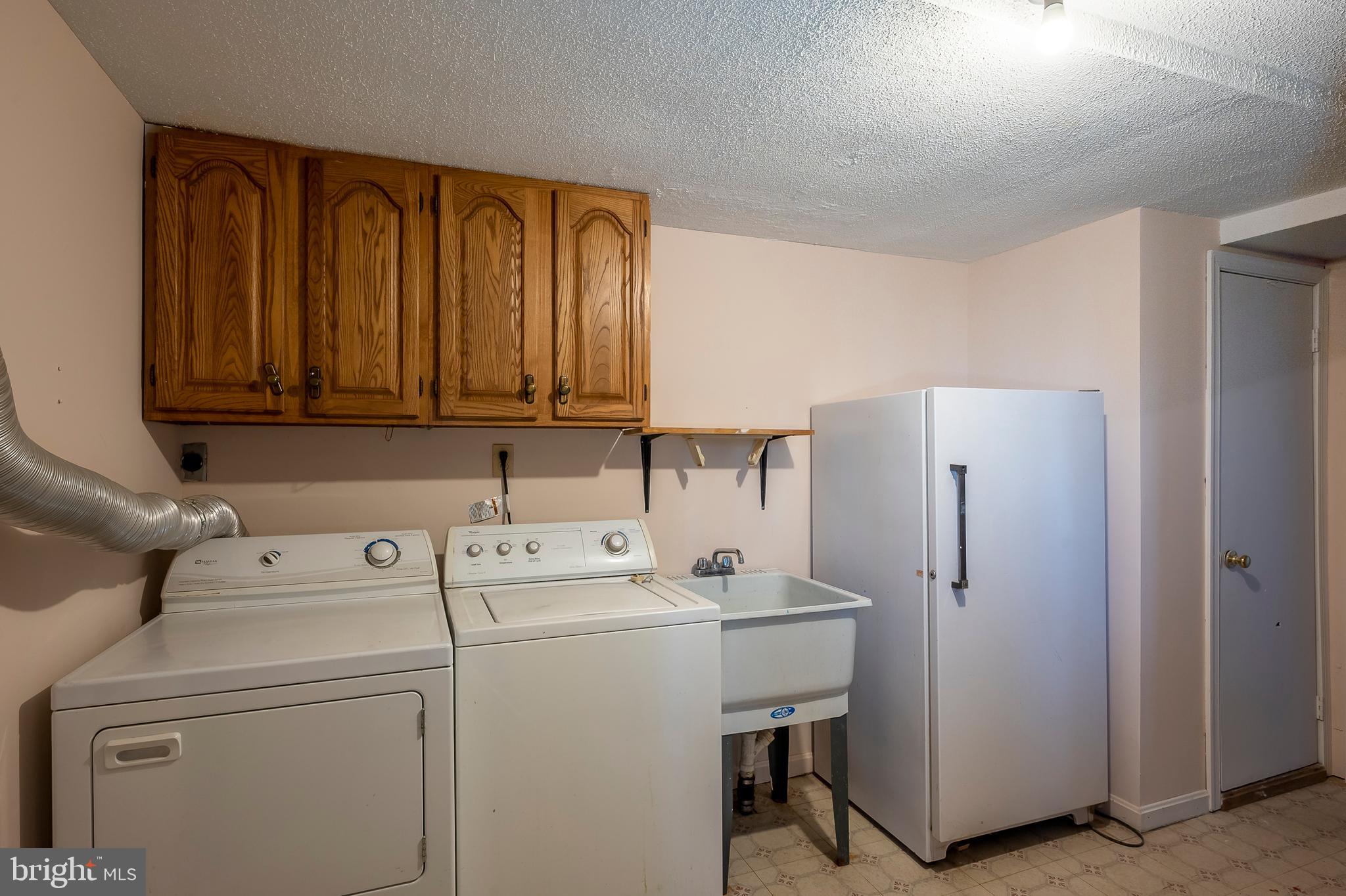 102 Westowne Road Baltimore, MD 21229 - Photo 24 of 31 Full laundry room with extra freezer