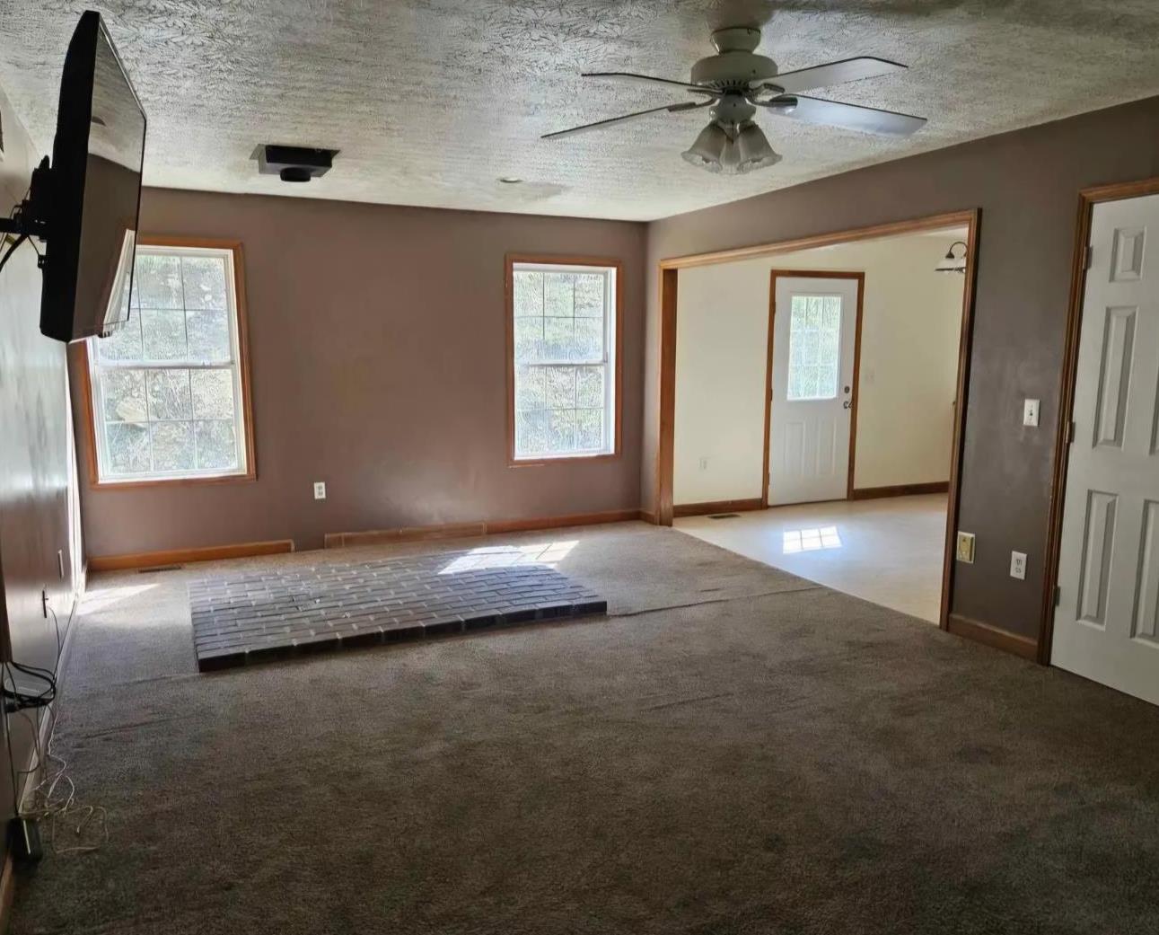 6049 Blue Creek Road Brookville, IN 47012 - Photo 16 of 17 Flooring and base for wood stove have been removed