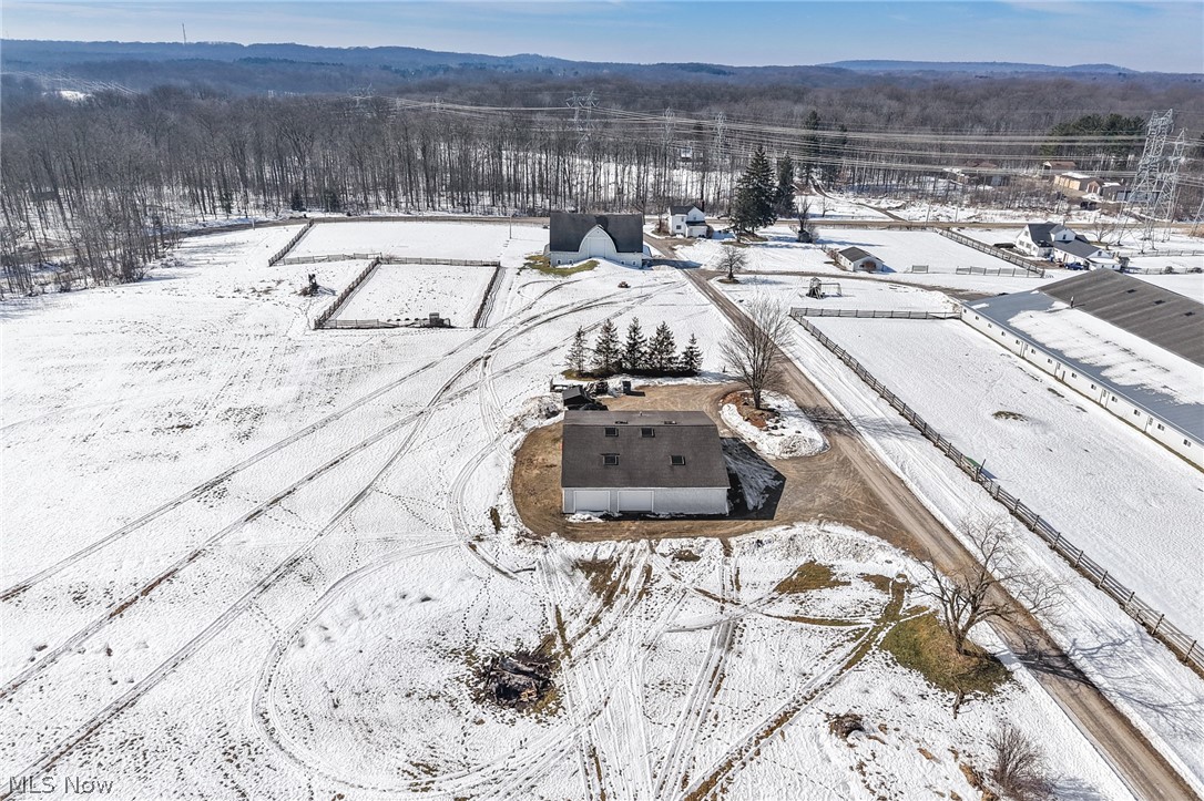 9455 Robinson Road Chardon, OH 44024 - Photo 29 of 33 Snowy aerial view featuring a mountain view