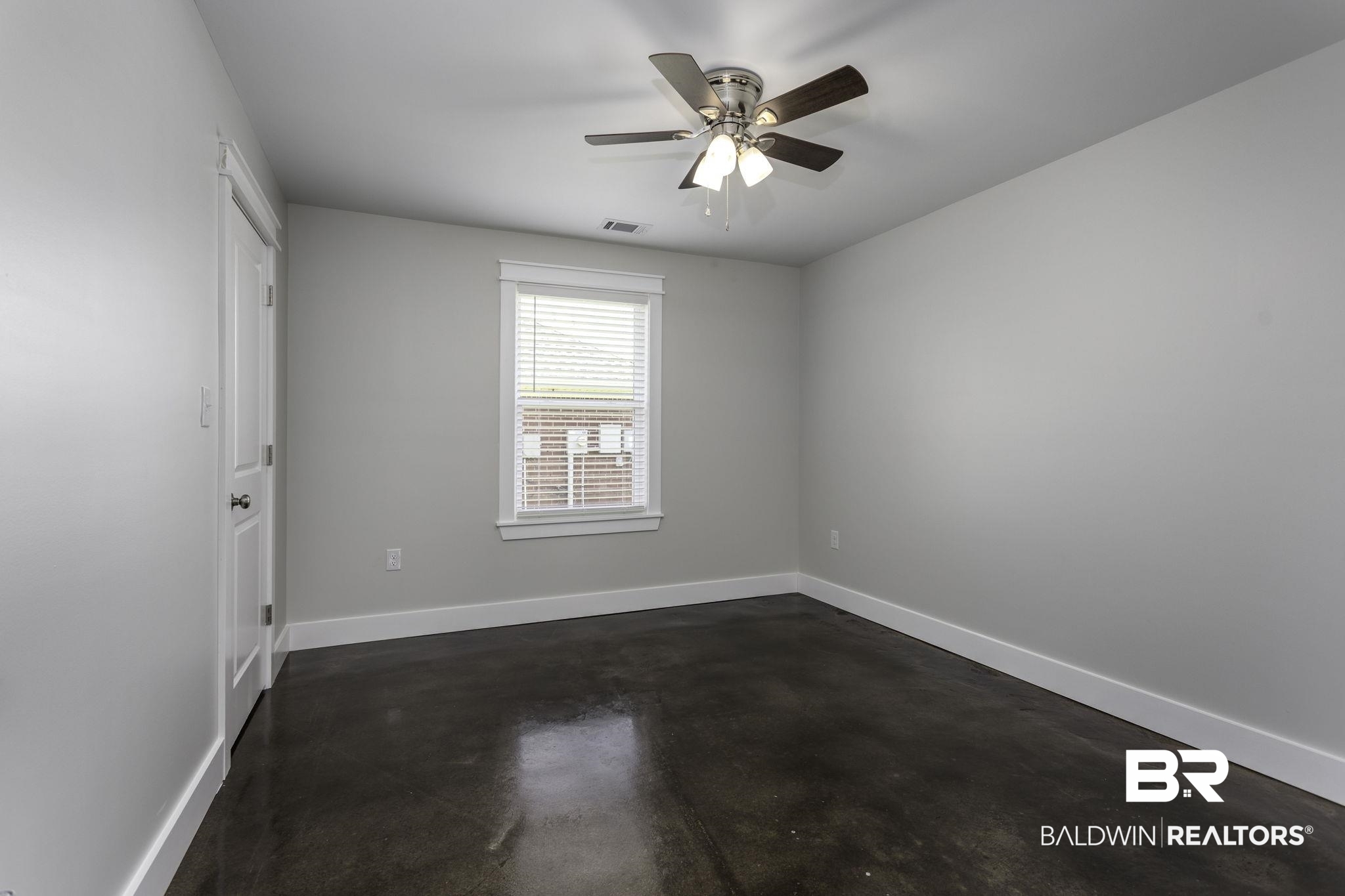 17126 Sugar Loop Foley, AL 36535 - Photo 13 of 28 Spare room featuring concrete flooring and ceiling fan