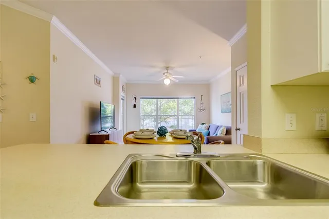 a view of a kitchen with a sink and cabinet