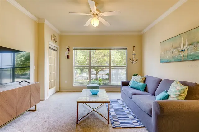 a living room with furniture and a large window