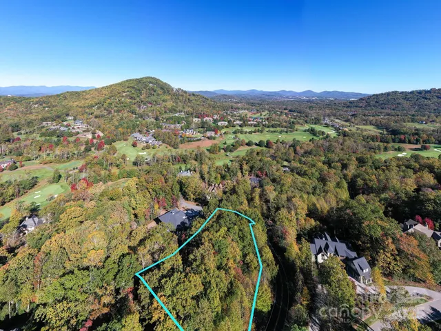 a view of a city with mountains in the background