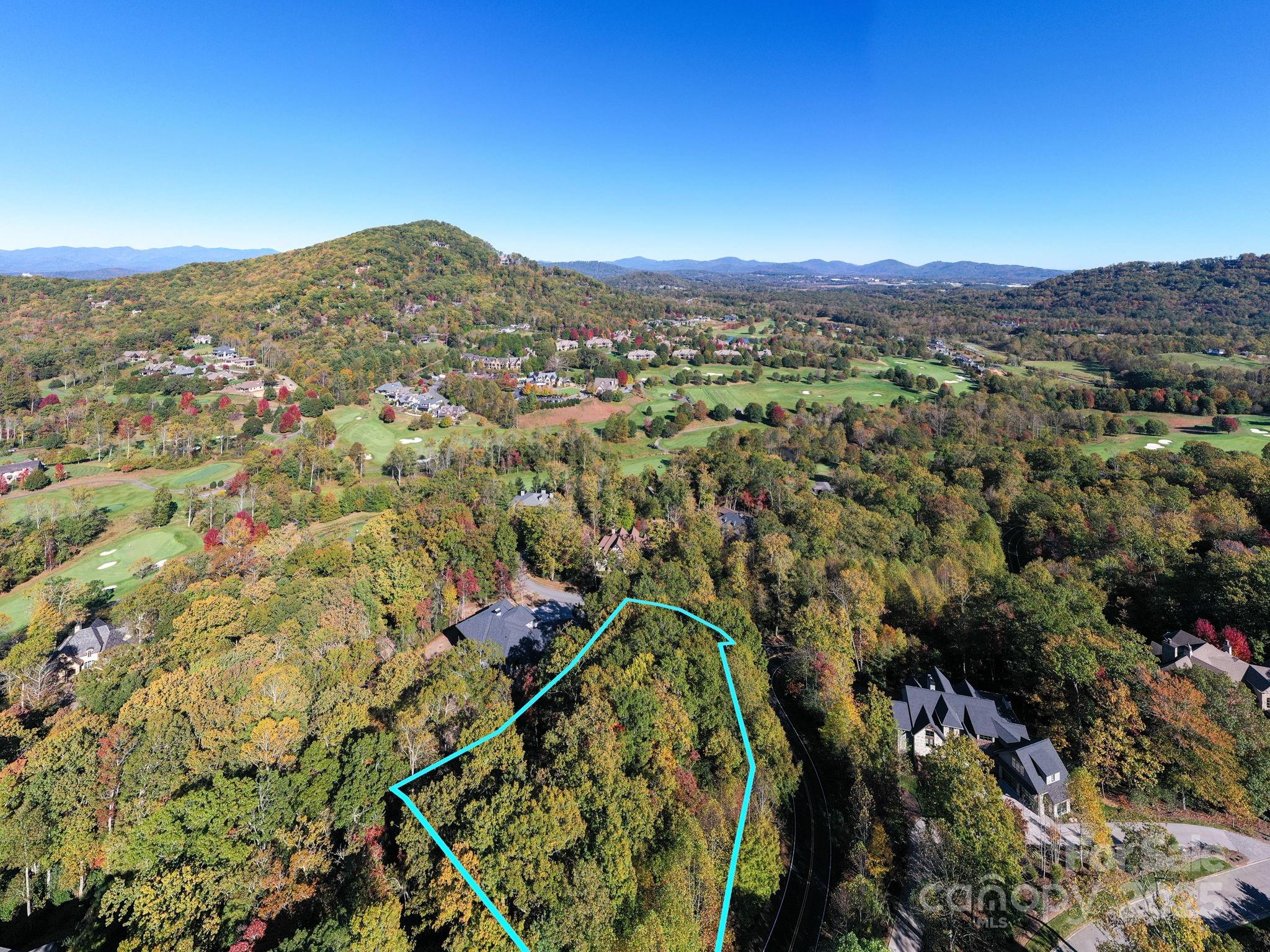 a view of a city with mountains in the background