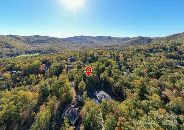 a street sign on a sidewalk next to a road