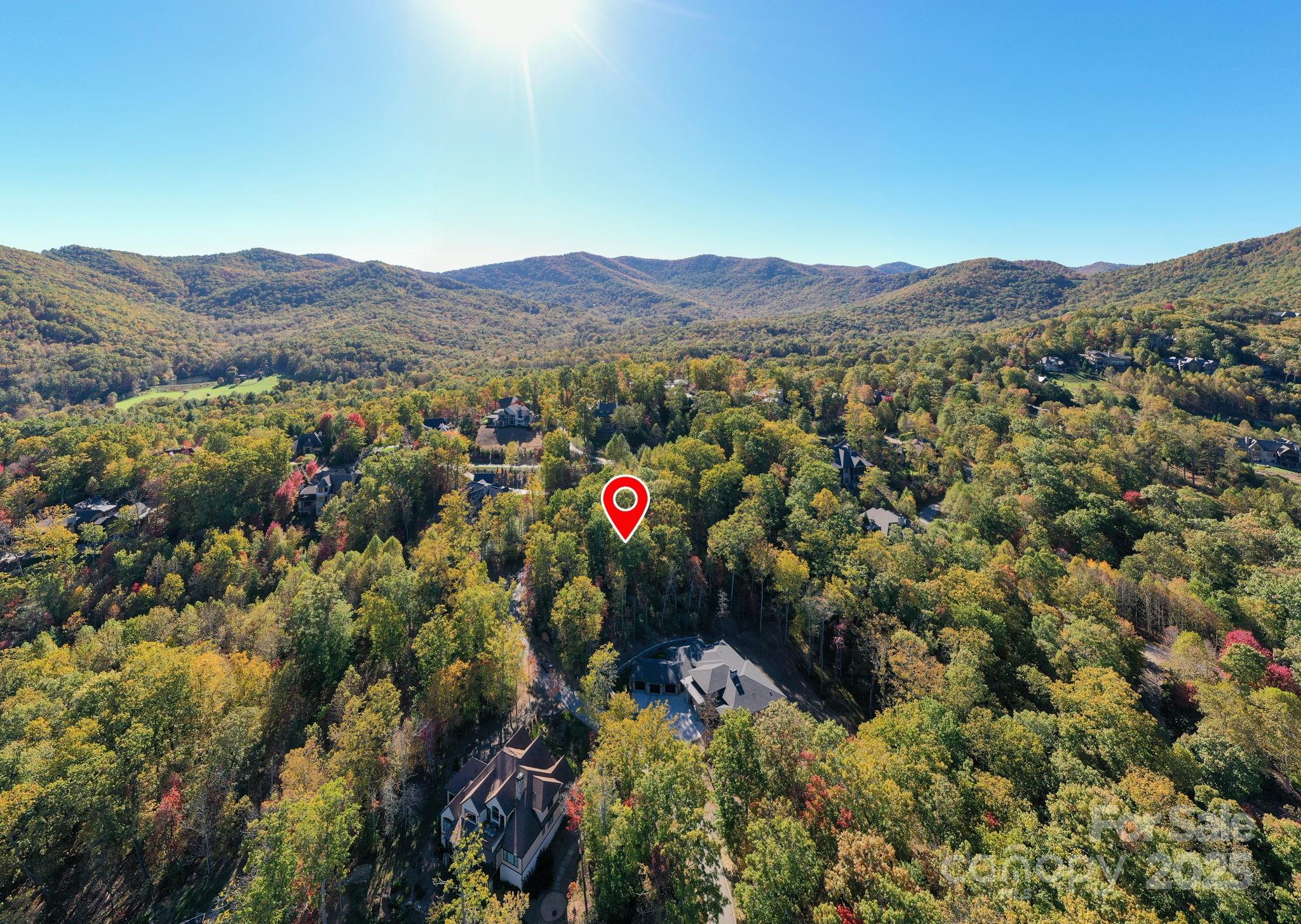 2002 Song Breeze Trail Arden, NC 28704 - Photo 15 of 19 a view of a lush green field with mountains in the background