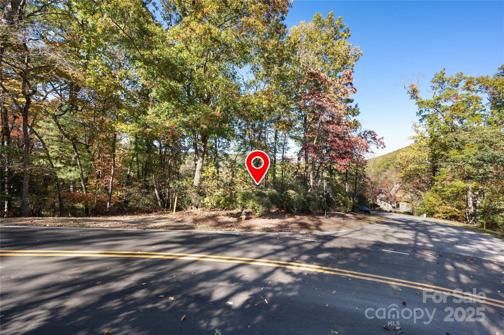 2002 Song Breeze Trail Arden, NC 28704 - Photo 17 of 19 a street sign on a sidewalk next to a road