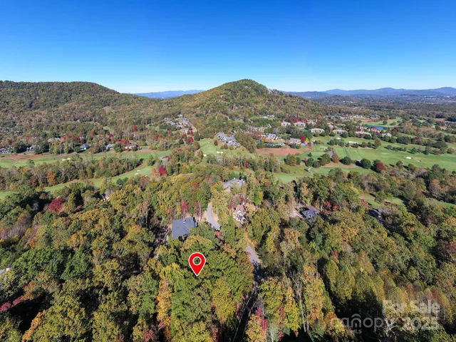 a view of a city with mountains in the background