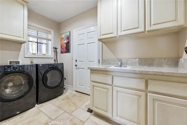 a bathroom with a sink and a washing machine