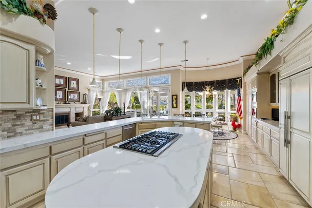 a large white kitchen with a large window