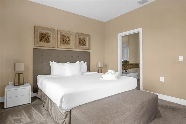 a bedroom with a bed and a couch