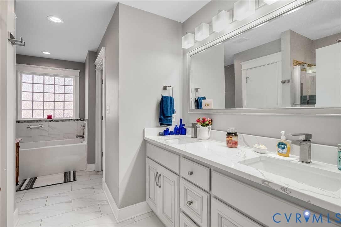 15330 Wilkinson Road Dinwiddie, VA 23841 - Photo 18 of 43 a bathroom with a tub sink and mirror
