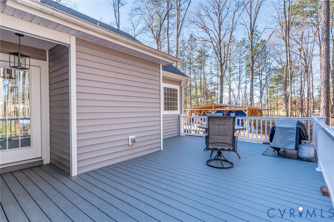 15330 Wilkinson Road Dinwiddie, VA 23841 - Photo 25 of 43 a view of a dinning tables and chairs in the roof deck