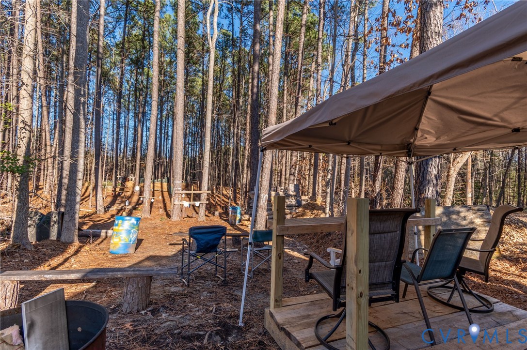 15330 Wilkinson Road Dinwiddie, VA 23841 - Photo 31 of 43 a view of a chairs and table in patio