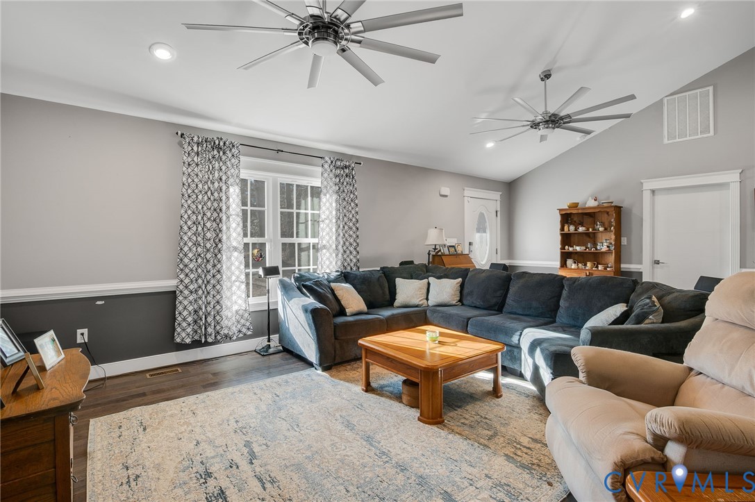 15330 Wilkinson Road Dinwiddie, VA 23841 - Photo 4 of 43 a living room with furniture a ceiling fan and a rug