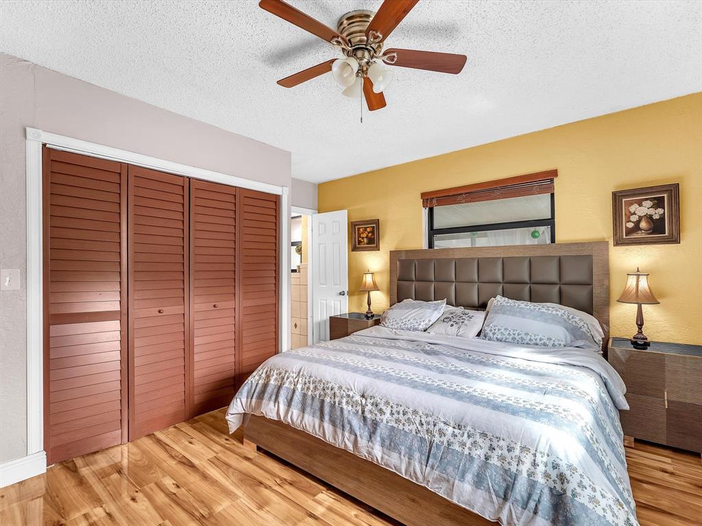 6631 Southwest 24th Street Miramar, FL 33023 - Photo 18 of 42 a bedroom with a bed and a large window