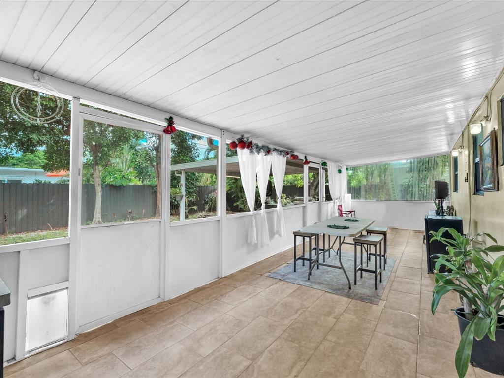 6631 Southwest 24th Street Miramar, FL 33023 - Photo 25 of 42 a view of a patio with a dining table and chairs