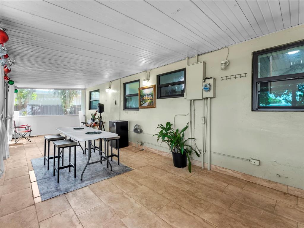 6631 Southwest 24th Street Miramar, FL 33023 - Photo 26 of 42 a view of a livingroom with furniture and flat screen tv