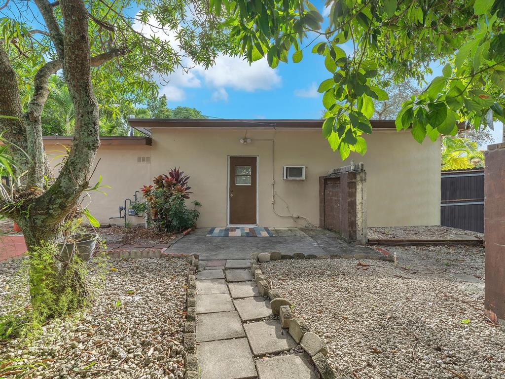 6631 Southwest 24th Street Miramar, FL 33023 - Photo 34 of 42 a front view of a house with garden
