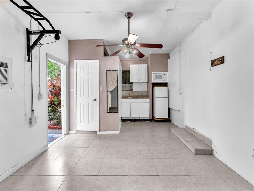 6631 Southwest 24th Street Miramar, FL 33023 - Photo 39 of 42 a view of a kitchen with a sink and refrigerator