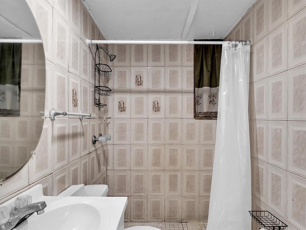6631 Southwest 24th Street Miramar, FL 33023 - Photo 42 of 42 a bathroom with a shower and a toilet