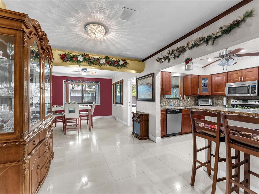 6631 Southwest 24th Street Miramar, FL 33023 - Photo 9 of 42 a view of a dining room with furniture window and outside view