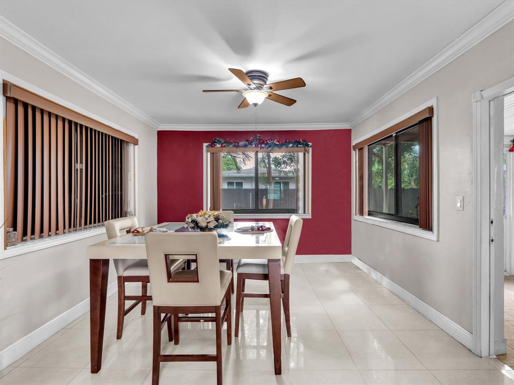6631 Southwest 24th Street Miramar, FL 33023 - Photo 10 of 42 a view of a dining room with furniture window and outside view